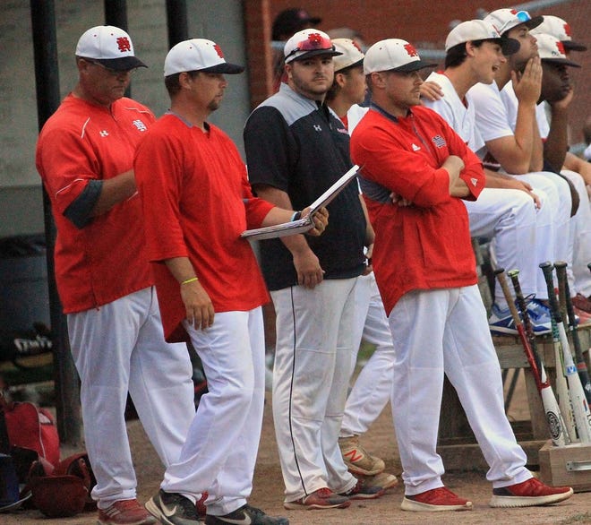 New Bern coach Mike Ellsworth (holding notebook in forefront) guided New Bern's baseball team to the third round of the state playoffs and a 22-5 record. Ellsworth is the 2019 Sun Journal Coach of the Year. [Gray Whitley / Sun Journal Staff]