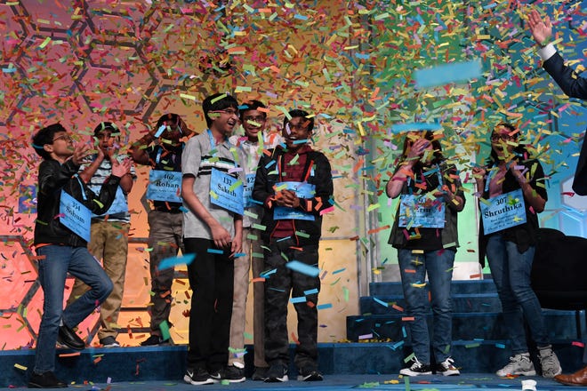The co-champions of the 2019 Scripps National Spelling Bee, from left, Sohum Sukhatankar, 13, of Dallas, Texas, Abhijay Kodali, 12, of Flower Mound, Texas, Rohan Raja, 13, of Irving, Texas, Saketh Sundar, 13, of Clarksville, Md., Christopher Serrao, 13, of Whitehouse Station, N.J., Rishik Gandhasri, 13, of San Jose, Calif., Erin Howard, 14, of Huntsville, Ala., and Shruthika Padhy, 13, of Cherry Hill, N.J., celebrate in Oxon Hill, Md., Friday, May 31, 2019. (AP Photo/Susan Walsh)