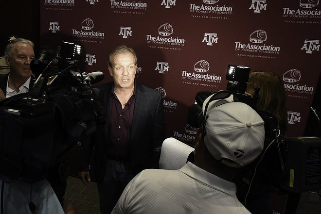Texas A&M coach Jimbo Fisher answers questions during an appearance at coach's night, sponsored by the Capital City A&M Club, at the Auistin Convention Center. [STEVE LEWIS/for STATESMAN]
