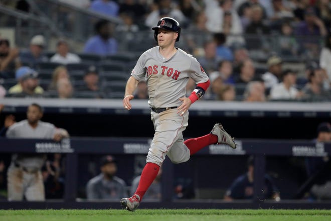 Boston Red Sox's Brock Holt scores on a single by Sandy Leon off New York Yankees starting pitcher Domingo German during the third inning of a baseball game, Saturday, June 1, 2019, in New York. (AP Photo/Julio Cortez)