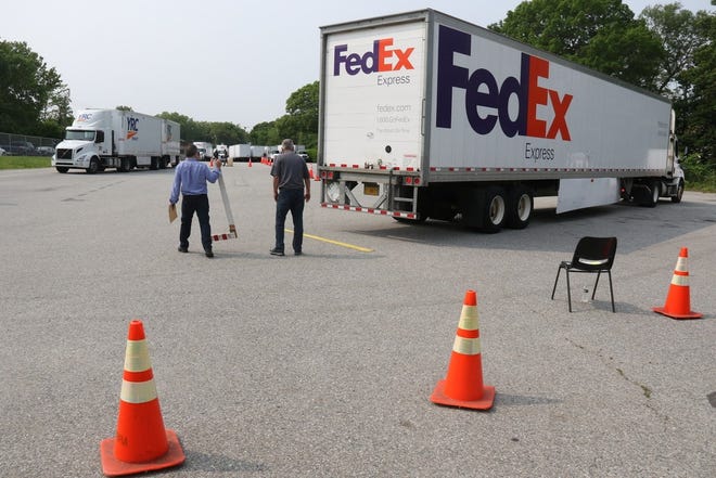 Some 30 professional truck drivers competed in the Rhode Island Truck Driving Championship on Saturday at the New England Tractor Trailer Training School's Pawtucket campus. David Lumpkin, of Hopkinton, a driver for FedEx Express, won top honors. [The Providence Journal / Sandor Bodo]