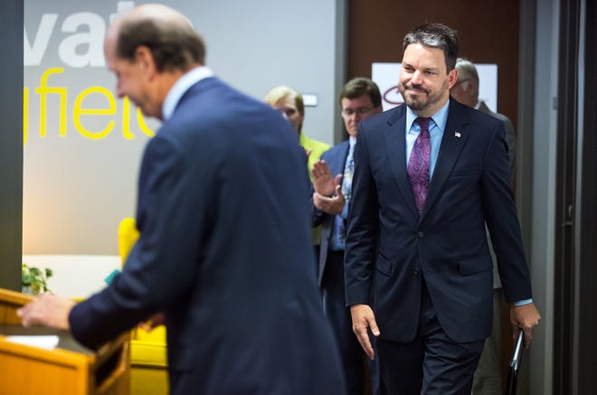 Eric Berglund approaches the podium after being named as the new CEO of the Land of Lincoln Economic Development Corporation during a press conference at Innovate Springfield Monday, July 16, 2018. [Ted Schurter/The State Journal-Register]