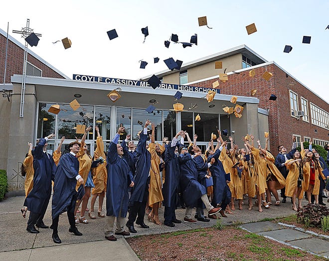 Coyle and Cassidy High School and Middle School held its graduation ceremony on Friday, May 31, 2019, at St. Mary's Church in Taunton. Graduates toss their caps in front of the school after graduation. [Taunton Gazette photo | Mike Gay]