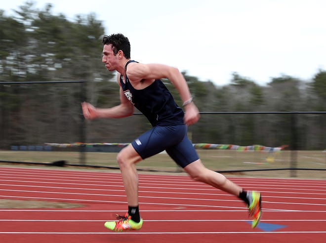 Pembroke's Christian Pulselli gets off the blocks and flies around the bend at the start of the 400 where he placed first with a time of 49.1 seconds that brought the school record for the 400 meter dash in their meet against Silver Lake at Pembroke High on Tuesday, Apr. 2, 2019. [Wicked Local Staff Photo/ Robin Chan]