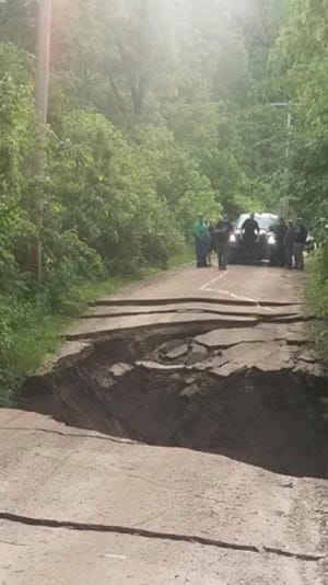 A sinkhole between Dahinda and Williamsfield is blocking traffic on Happy Hollow Drive. On Sunday, Knox County Sheriff's Department reports the dam at Happy Hollow has failed. [TYLER GRUBB/SUBMITTED]