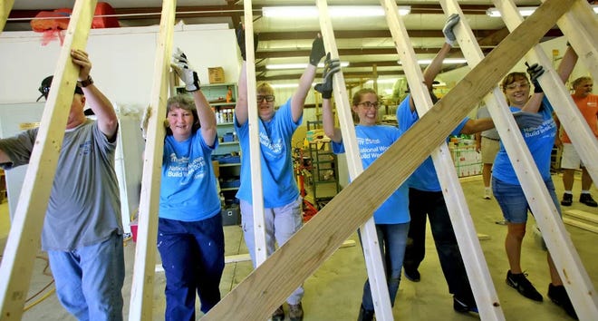 A wall is raised at the first Women Build event at Habitat for Humanity's ReStore in 2018. [Brittany Randolph/The Star]