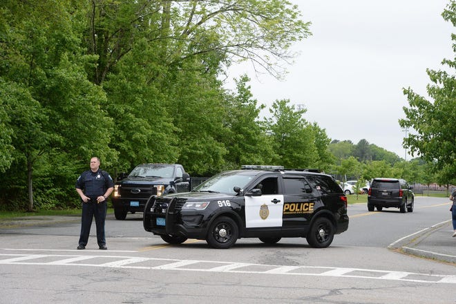 Police block the entrance to the school. All students are reported to be safe at Bridgewater-Raynham Regional High School. A fire alarm was pulled by a teacher who heard a threat about a gun, but authorities determined there was no imminent threat. Parents and guardians still showed up to pull the students out for the day on Wednesday, May 29, 2019. (Marc Vasconcellos/The Enterprise)
