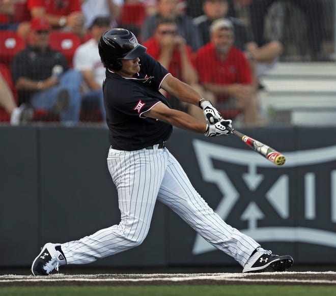 Texas Tech's Cameron Warren hits a three-run home run in the first inning Sunday against Dallas Baptist. It was all the Red Raiders would need offensively as they won 3-0 to advance to a super regional they will host. [Brad Tollefson/Lubbock Avalanche-Journal]
