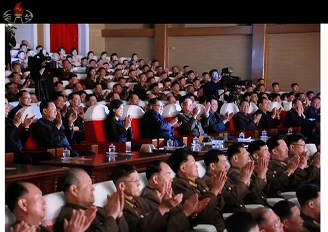 This image made from video of a still image broadcasted Monday, June 3, 2019, by North Korea's KRT shows senior North Korean official Kim Yong Chol, second from right, and a clapping Kim Jong Un, center, sitting in the same row along with other top officials during a musical performance by the wives of Korean People's Army officers Sunday, June 2, 2019. The senior North Korean official who had been reported as purged over the failed nuclear summit with Washington was shown in state media on Monday enjoying a concert near leader Kim.