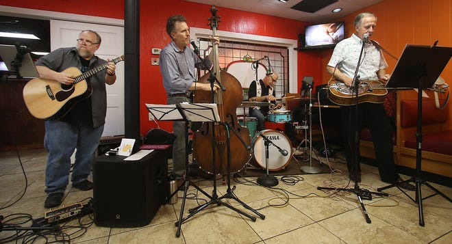 From right, Jack Yarbrough, Chuck Brimer, Fred Little and Larry Brimer of Carolina Sonrise perform at Union Diner Monday evening, May 6, 2019. [Mike Hensdill/The Gaston Gazette]