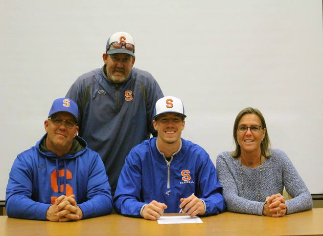 Saugatuck senior Brad Dunn signs with Grand Rapids Community College for baseball, next to his parents Bill and Bev Dunn and coach Tim Antel. [Courtesy/Bill Dunn]