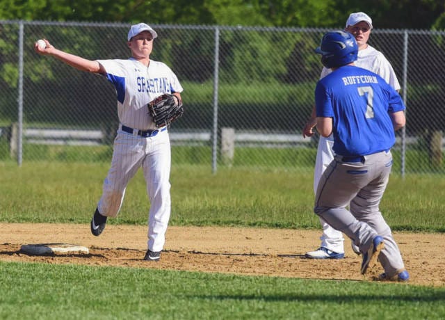Collins-Maxwell shortstop Blake Huntrods gets ready to throw to first in an attempted double play after tagging second to force out Colo-NESCO’s Kaleb Ruffcorn during the Spartans’ 11-6 loss to the Royals May 30 at Collins.