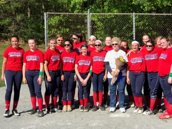 Lady Raiders with Liz Chellel, the first Lady Raiders softball coach. The Lady Raiders of Dorothy L. Beckwith Middle School hosted their first “truly home” softball game in many years at Beckwith Middle School on Tuesday, May 21. [Submitted photo]