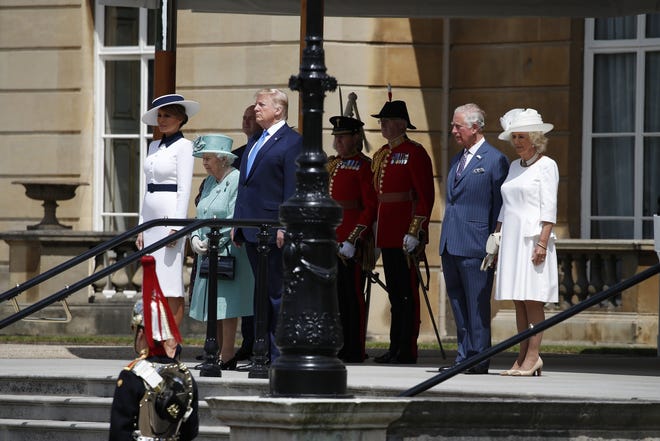 President Donald Trump stands with Queen Elizabeth II, with first lady Melania Trump, left, and Prince Charles and Camilla, the Duchess of Cornwall, right, at Buckingham Palace on Monday in London. [AP Photo/Alex Brandon]