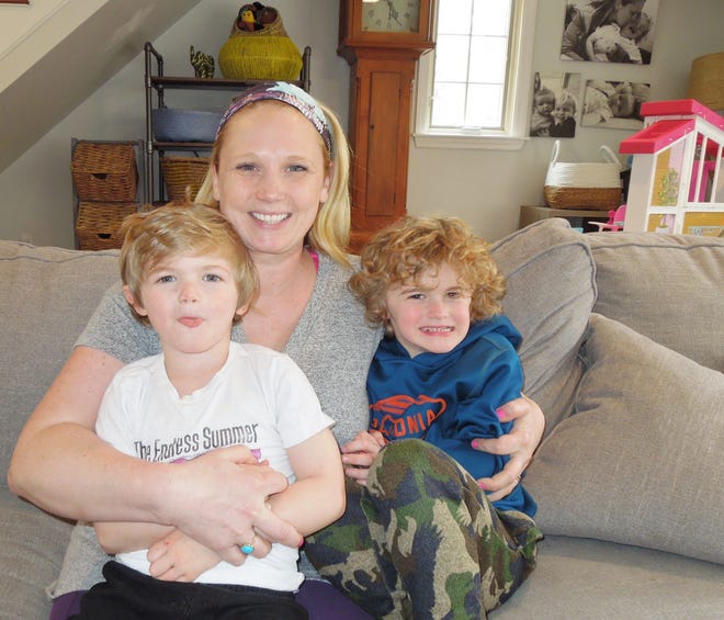 Tucker, 6, and Beau, 4, sit with Mom, Christine Belliveau in their Plympton home. [Photo courtesy of Nick Gilbert]