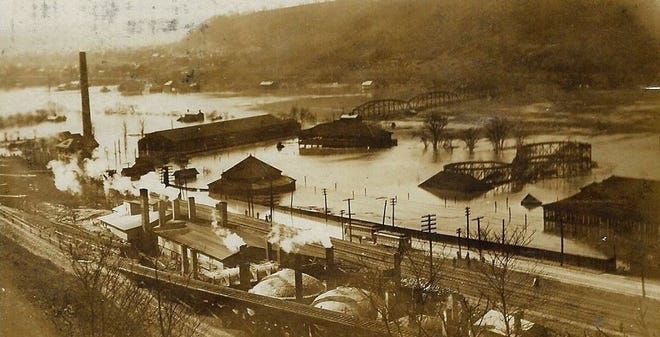 Junction Park was always prone to flooding, as seen here in 1907 when the Beaver River flexed its muscles. This view gives us an overview of the park grounds. For orientation, the bridge in the middle of the photo is the Sharon Bridge, which sat on the same spot where the Veterans Memorial Bridge sits today. The long building at the foot of the bridge was the Beaver Valley Traction Co. car barn. The carousel building with the pointed top sits in what would someday be the YMCA parking lot. [Beaver County Historical Research & Landmarks Foundation]