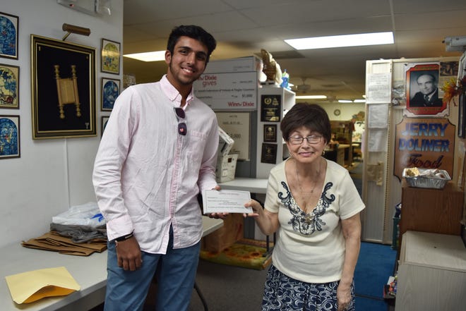 Rishi Desai donated 100 coupons for free mammograms to Gloria Max, executive director of the Jewish Federation of Volusia & Flagler Counties, to distribute to local women in need. (Photo provided)