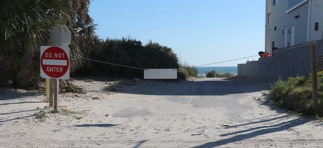 With some expecting the federal government to signal an end to Volusia's beach driving tradition in a little more than a decade, the County Council voted 4-3 Tuesday to add as many off-beach parking spaces as possible at a long-abandoned beach approach at 16th Avenue, that's squeezed between two homes in New Smyrna Beach. [News-Journal File/David Tucker]