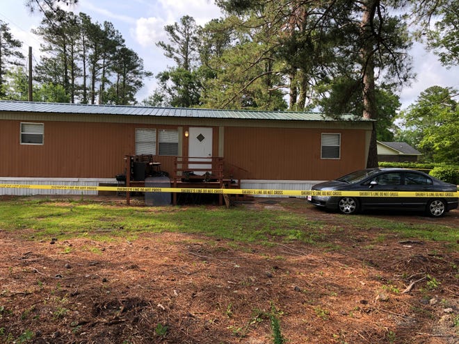 The Onslow County Sheriff's Office taped off the residence at 139 Hubert Blvd. in Patriots Place where a homicide investigation began Tuesday night. Derrick Lamell Bennett, 32, has been charged with an open count of murder. [Maxim Tamarov / The Daily News]