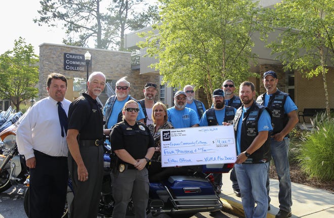 The Veteran Enforcers Motorcycle Association (VEMA) of New Bern presents a $4,000 check to the Craven CC Foundation on May 28 to benefit students in the collegeís Basic Law Enforcement Training program.[CONTRIBUTED PHOTO]