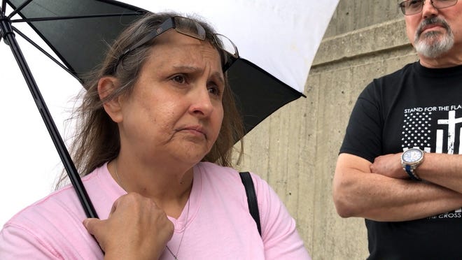 Lisa Coleman, 50, and her brother James Allen, 60, both of Columbus, wait outside the Franklin County Jail for the arrival of Dr. William Husel to be processed on 25 counts of murder Wednesday. Their father, James Allen, of Franklinton died at Mount Carmel West on May 28, 2018, one day shy of his birthday. [Adam Cairns/Dispatch]