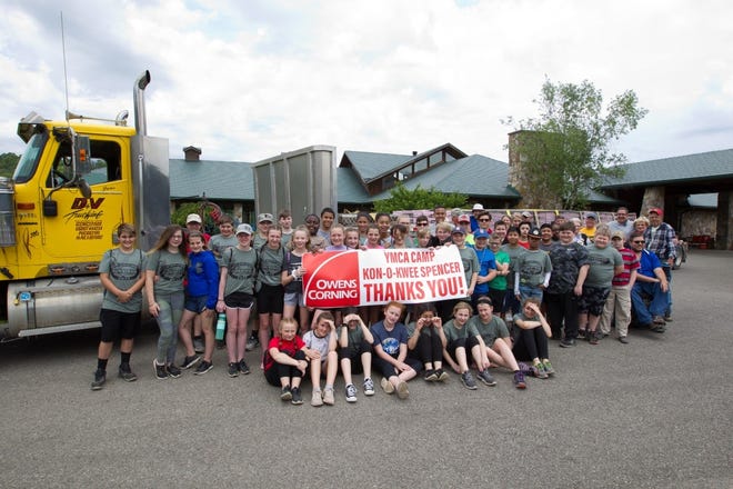 Campers and staff at YMCA Camp Kon-O-Kwee Spencer in Marion Township show their gratitude for the donation of shingles that will be used to repair building roofs at the camp. [Submitted]