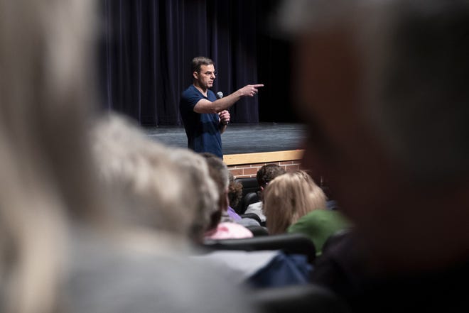 U.S. Rep. Justin Amash, R-Cascade Township, holds a town hall meeting at Grand Rapids Christian High School's DeVos Center for Arts and Worship on Tuesday, May 28, 2019. The congressman came under scrutiny May 18 when he posted a series of Tweets to outline his support for impeachment proceedings. As such, he is the only Republican congress member to do so. The following days brought an announcement from the wealthy DeVos family about no longer supporting him financially. (Cory Morse/The Grand Rapids Press via AP)