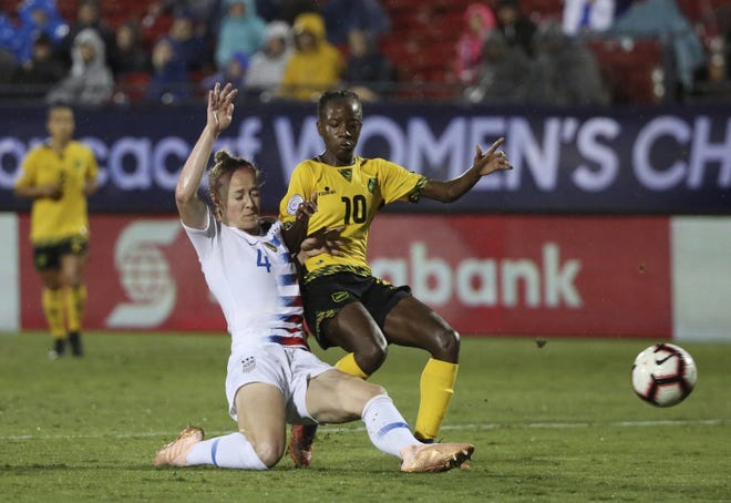 United States defender Becky Sauerbrunn, left, defends against Jamaica forward Jody Brown during the second half of a CONCACAF women's World Cup qualifying tournament soccer match in Frisco, Texas in October. [Andy Jacobsohn/Associated Press, File]