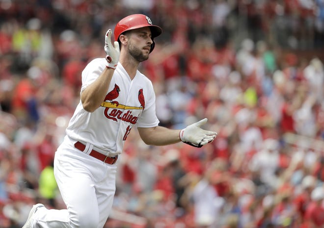St. Louis Cardinals' Paul DeJong celebrates as he rounds the bases after hitting a two-run home run during the seventh inning of a baseball game against the Cincinnati Reds on Thursday in St. Louis. [Jeff Roberson/The Associated Press]