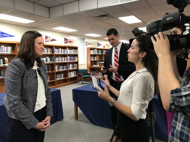 Florida Attorney General Ashley Moody discusses teen vaping in Nassau County with members of the media. Moody held a roundtable discussion Thursday with school administrators and law enforcement regarding e-cigarette use by teens. [Emily Bloch/Florida Times-Union]