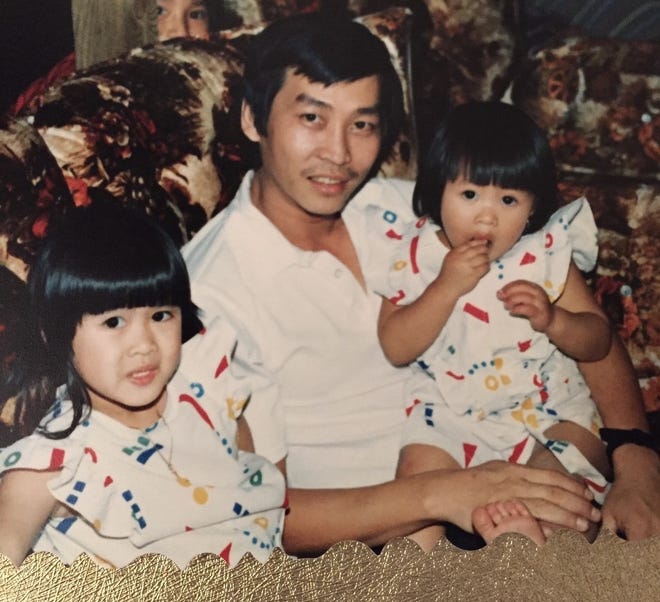 Phat Nguyen is pictured in an undated photo with his daughters, from left, Lisa and Linda. [Special to The Gazette]