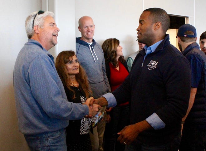 John James greets his supporters during a campaign stop on Nov. 3, 2018, at the Holland Civic Center. James ran for U.S. Sen. Debbie Stabenow's seat, but lost in the November election. He announced on Thursday, June 6, his candidacy for U.S. Sen. Gary Peters seat. [Sentinel file]