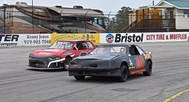 Stephen Sanders (16) and Kris Hetu battle for the lead during a Mini-Stock race on April 14. [Josh Parrish /Short Track Central]