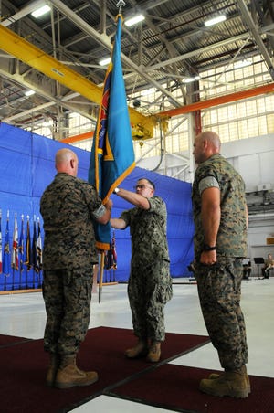 Cutline: Capt. Mark E. Nieto assumed command of Fleet Readiness Center East from Col. Clarence T. Harper III during a change of command ceremony at the depot, May 31, 2019. [HEATHER WILBURN/PHOTO]