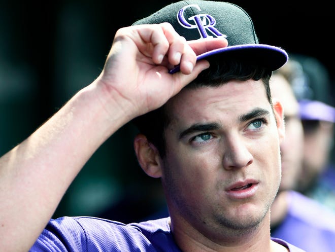 Colorado Rockies starting pitcher Peter Lambert (23) gestures in the dugout after completing the seventh inning of a baseball game against the Chicago Cubs, Thursday, June, 6, 2019, in Chicago. (AP Photo/David Banks)