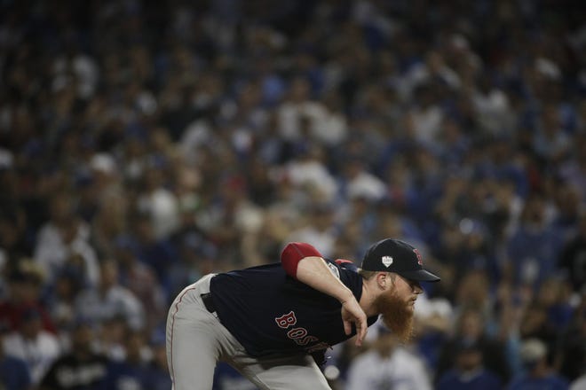 Boston Red Sox relief pitcher Craig Kimbrel prepares to throw against the Los Angeles Dodgers during the ninth inning in Game 3 of the World Series baseball game on Friday, Oct. 26, 2018, in Los Angeles. (AP Photo/Jae C. Hong)