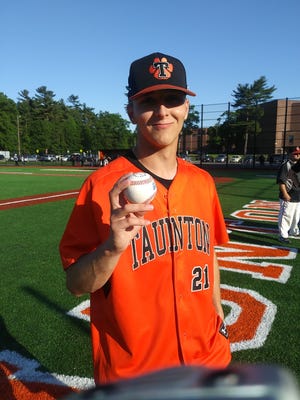 Taunton High senior pitcher Jack Moynihan holds up a baseball after blanking Marshfield in his complete-game win on the hill. Moynihan fanned 12 batters and walked just one in a 6-0 victory at Taunton High school on Thursday.

[Taunton Gazette photo | Steven Sanchez]