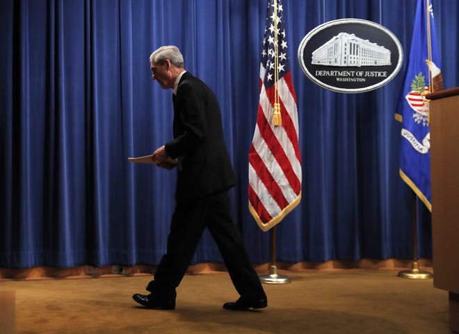Special counsel Robert Mueller leaves the podium after speaking about the Russia investigation at the Department of Justice in Washington on May 29. [AP PHOTO/CAROLYN KASTER]