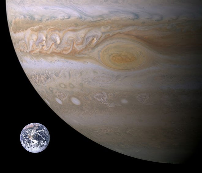 Jupiter and Earth, compared in size. Earth was photographed by Apollo 17 in 1972 and Jupiter, from the Cassini space probe in 2000.

[NASA/public domain/Wikimedia Commons]
