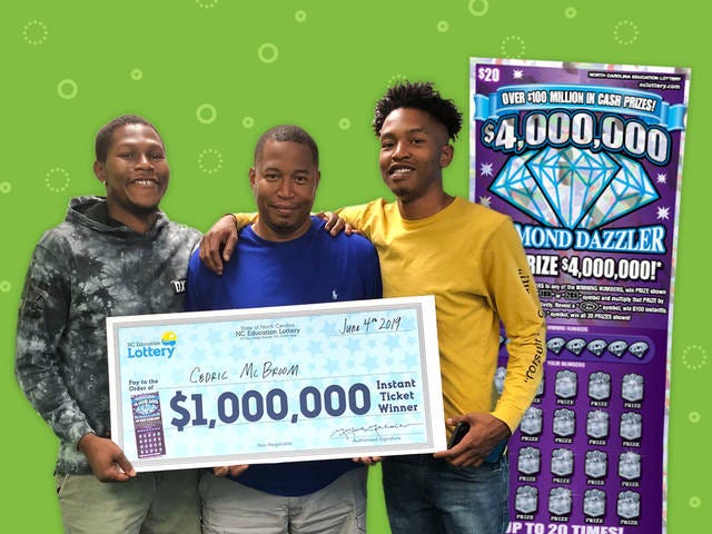 DELIVERING GOOD NEWS — Postal worker Cedric McBroom, center, celebrates his $1 million win with his sons Deshane, left, and Keshon. (Contributed)