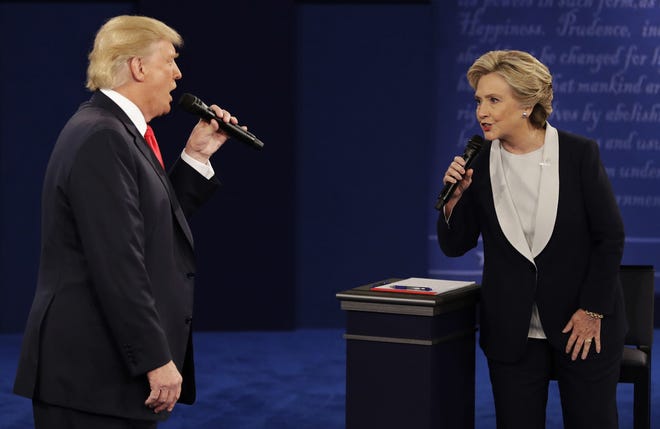 Donald Trump and Hillary Clinton speak during a presidential debate on Oct. 9, 2016, in St. Louis. Florida is one highly partisan state these days. [AP Photo/John Locher, File]