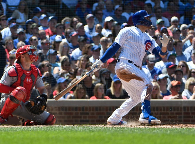 Chicago Cubs' Victor Caratini hits an RBI double against the St. Louis Cardinals during the fourth inning Friday, June, 7, 2019, in Chicago. [DAVID BANKS/THE ASSOCIATED PRESS]
