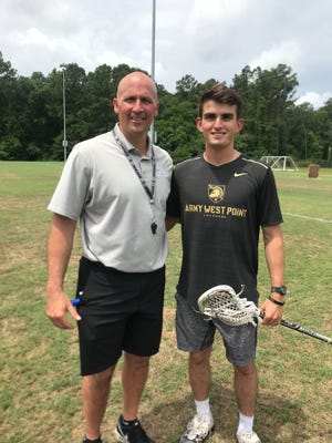 From left, Army head men's lacrosse coach Joe Alberici and 2017 Army team captain Gunnar Miller, who is now a first lieutenant stationed at Fort Stewart in Hinesville. [LATRICE WILLIAMS/SAVANNAHNOW.COM]