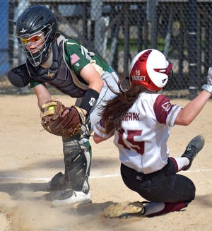 Doherty's Bridget Murray slides across the plate with the winning run, just ahead of the tag from Nashoba catcher Madeleine Arsenault during the Highlanders 2-1 win in a Division 1 Central quarterfinal on Friday. [T&G Staff/Steve Lanava]
