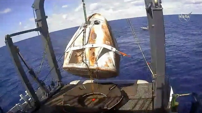The SpaceX Crew Dragon capsule is hoisted March 8 onto a ship in the Atlantic Ocean off the Florida coast after it returned from a mission to the International Space Station. SpaceX said May 2 that its Dragon capsule for astronauts was destroyed during a ground test April 20 at Cape Canaveral. [NASA via AP, File]