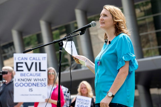 In this Tuesday, June 12, 2018 file photo, rape survivor and abuse victim advocate Mary DeMuth speaks during a rally protesting the Southern Baptist Convention's treatment of women outside the convention's annual meeting at the Kay Bailey Hutchison Convention Center in Dallas. On Tuesday, June 11, 2019, the Southern Baptist Convention gathers for its annual national meeting with one sobering topic — sex abuse by clergy and staff — overshadowing all others. (AP Photo/Jeffrey McWhorter)