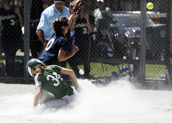 Abington's Meagan McCadden slides into home plate before Coyle-Cassidy's pitcher Sarah Rebello recieves the ball to tie the game 3-3 for Abington in the fourth inning. The Green Wave defeated the Warriors 14-4 in the Division III South quarterfinals at Abington. 

[Enterprise photo | Alyssa Stone]