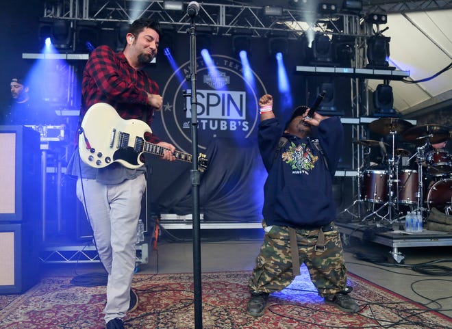In this March 18, 2016, photo Bushwick Bill, right, joins Deftones' Chino Moreno onstage at the Spin Party at Stubb's during South by Southwest. A publicist for rapper Bushwick Bill says the founder of the iconic Houston rap group the Geto Boys has died. [Contributed by Jack Plunkett/Invision/AP]