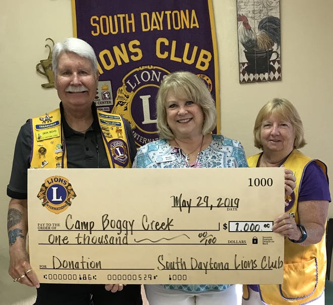 From left, Lion Dick Boyd, Camp Boggy Creek Major Gift Officer Wendy Proctor and Lion Carene Darcy. (Photo provided)