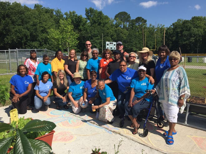 Garden project team members and Hastings Senior Center participants at the Produce & Pollinator Garden Project at the W.E. Harris Community Center in Hastings. (Contributed photo)